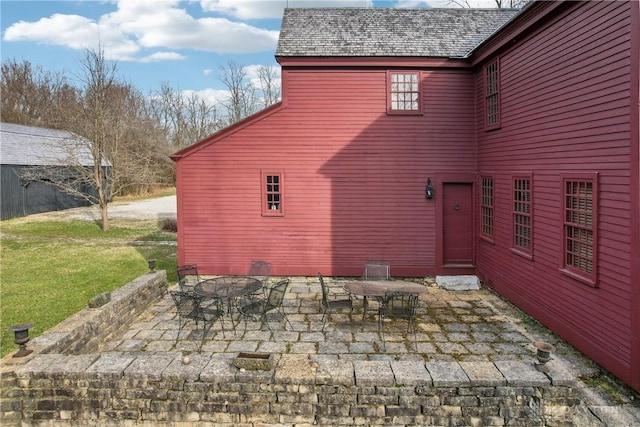 exterior space with a patio and a yard