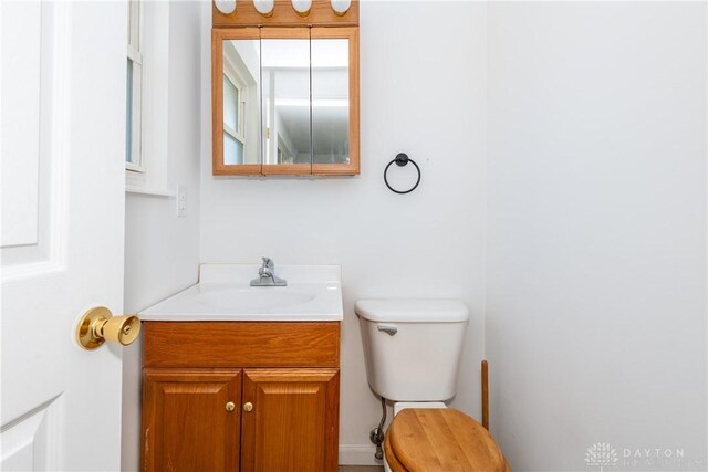 half bath with toilet and vanity
