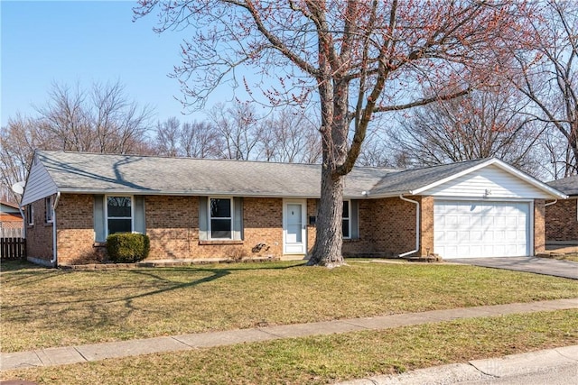 ranch-style house with fence, driveway, a front yard, brick siding, and a garage