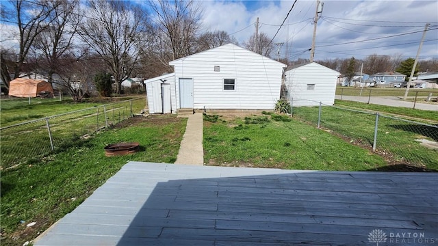 229 First, Piqua, OH 45356 - view of yard with a wooden deck and an outbuilding