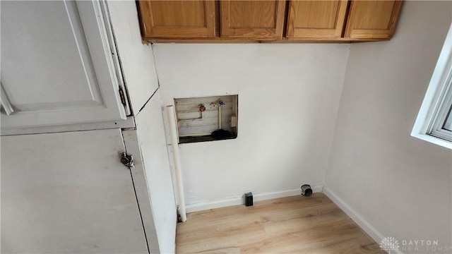 229 First, Piqua, OH 45356 - washroom featuring cabinet space, light wood-type flooring, hookup for a washing machine, and baseboards