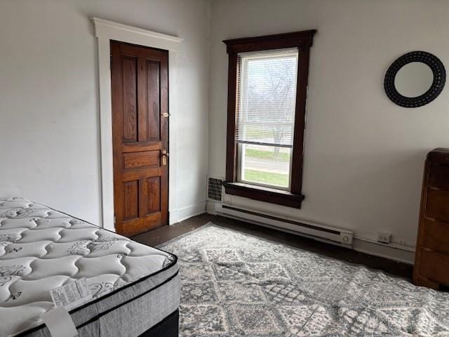 324 Warren St, Dayton, OH 45402 - bedroom with a baseboard heating unit and baseboards