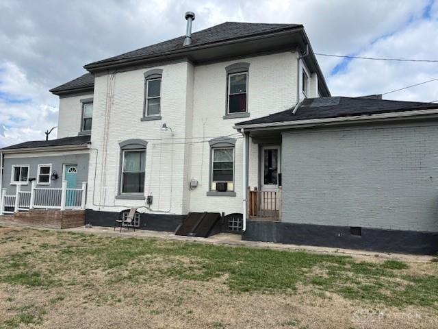 324 Warren St, Dayton, OH 45402 - back of property with a lawn and brick siding