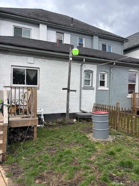 324 Warren St, Dayton, OH 45402 - back of property with fence and brick siding