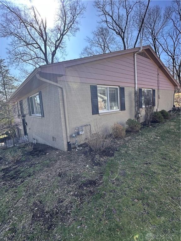 1314 Ridgeview Ave, Dayton, OH 45409 - view of property exterior with crawl space, a yard, and brick siding