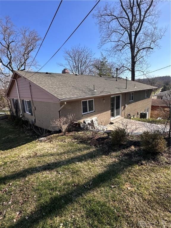 1314 Ridgeview Ave, Dayton, OH 45409 - back of house featuring a lawn