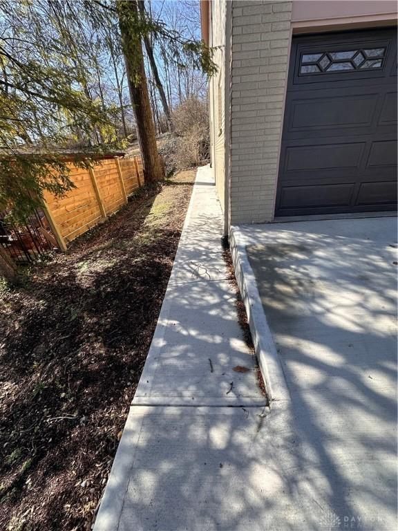 1314 Ridgeview Ave, Dayton, OH 45409 - view of side of property featuring brick siding and a garage