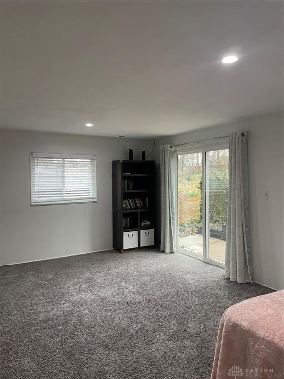 1314 Ridgeview Ave, Dayton, OH 45409 - bedroom with access to exterior, multiple windows, carpet flooring, and recessed lighting