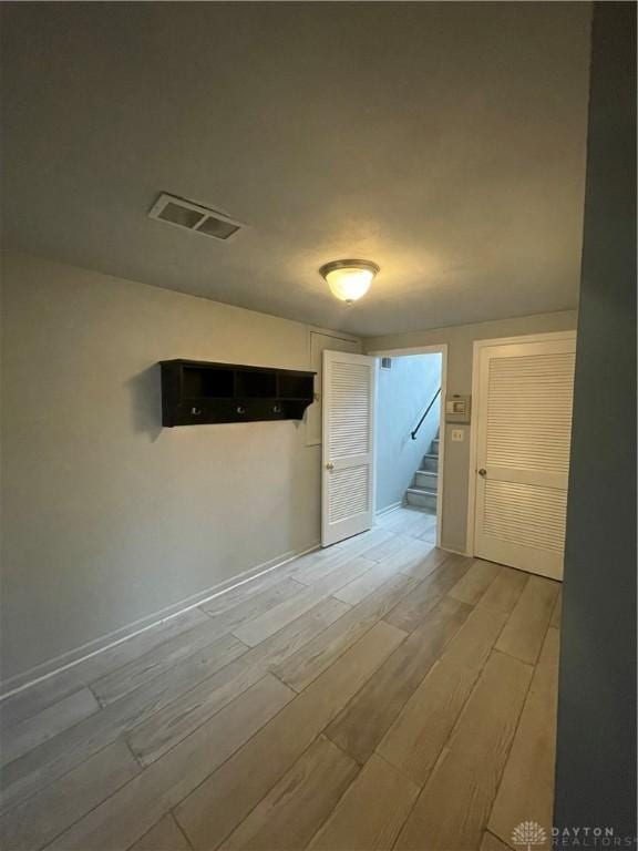 1314 Ridgeview Ave, Dayton, OH 45409 - unfurnished room featuring light wood finished floors and stairs