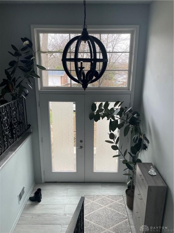 1314 Ridgeview Ave, Dayton, OH 45409 - entrance foyer with french doors and light wood-style flooring