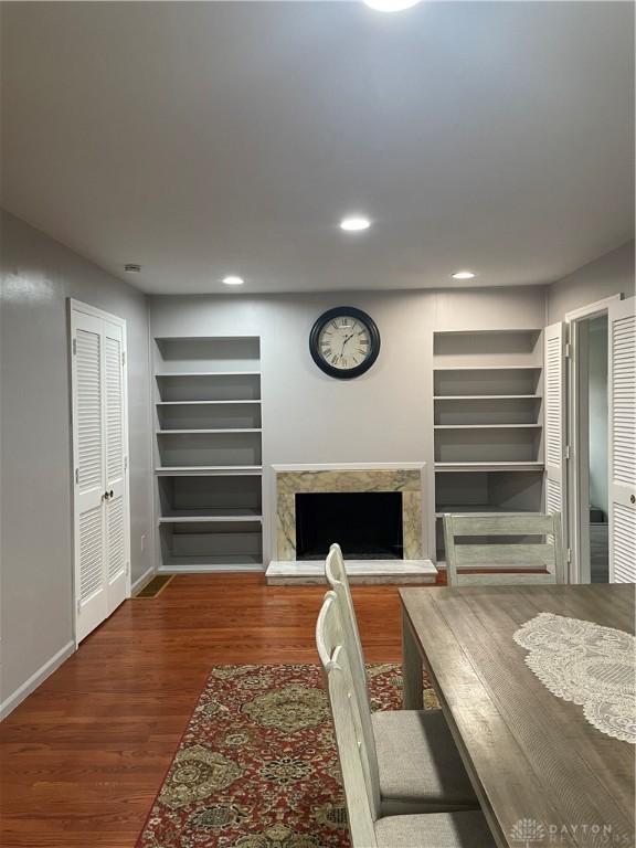1314 Ridgeview Ave, Dayton, OH 45409 - living area featuring built in features, a premium fireplace, wood finished floors, and recessed lighting