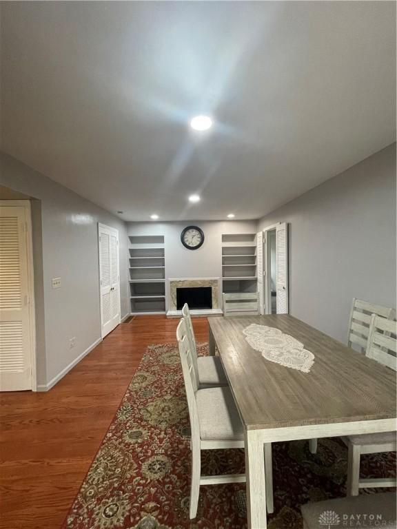 1314 Ridgeview Ave, Dayton, OH 45409 - dining space featuring wood finished floors, recessed lighting, and a fireplace