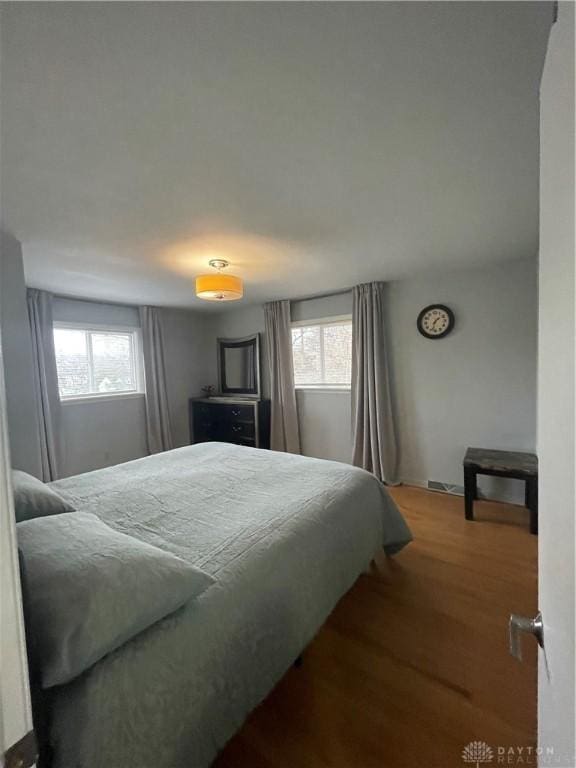 1314 Ridgeview Ave, Dayton, OH 45409 - bedroom with multiple windows and wood finished floors