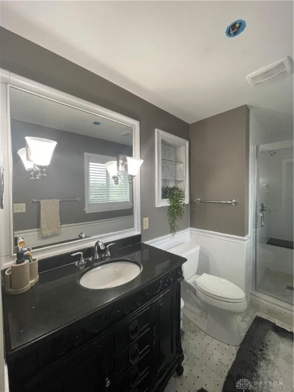 1314 Ridgeview Ave, Dayton, OH 45409 - bathroom with a wainscoted wall, vanity, and a stall shower