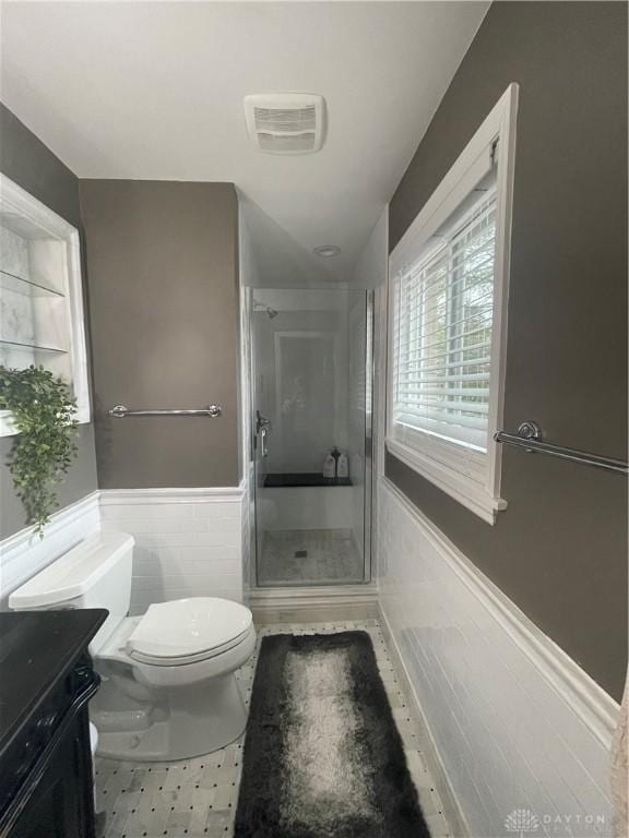 1314 Ridgeview Ave, Dayton, OH 45409 - full bath featuring a shower stall, a wainscoted wall, vanity, and tile walls