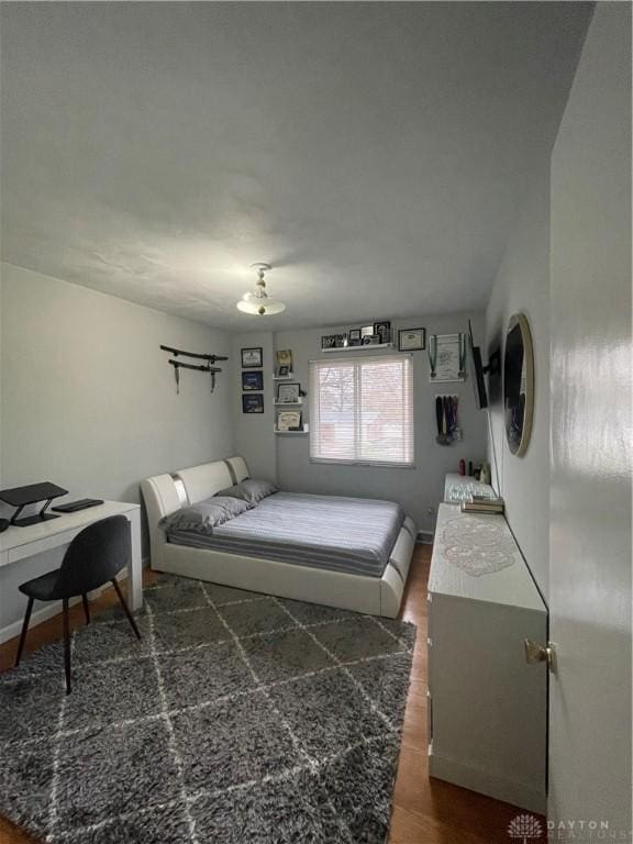 1314 Ridgeview Ave, Dayton, OH 45409 - bedroom with dark wood finished floors and a desk