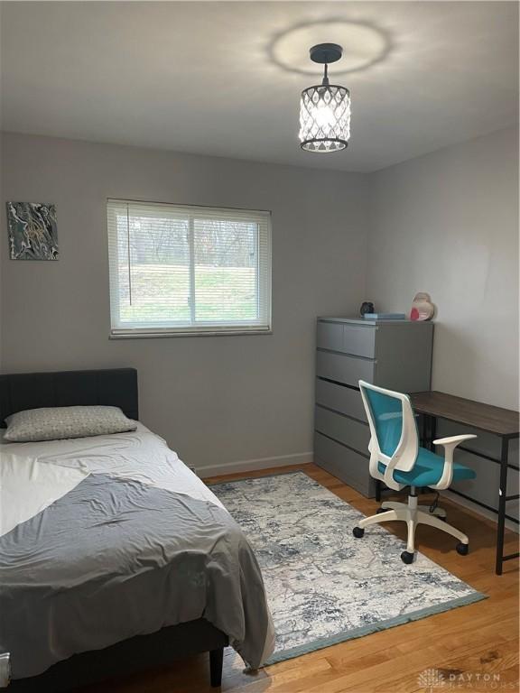 1314 Ridgeview Ave, Dayton, OH 45409 - bedroom with wood finished floors and an office area