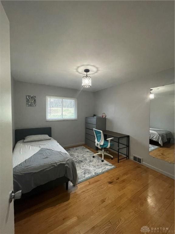 1314 Ridgeview Ave, Dayton, OH 45409 - bedroom with wood finished floors and a desk