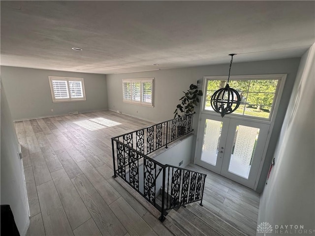 1314 Ridgeview Ave, Dayton, OH 45409 - foyer featuring french doors, wood finished floors, and a chandelier