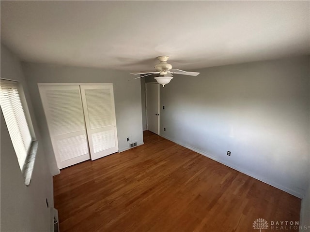 1314 Ridgeview Ave, Dayton, OH 45409 - unfurnished bedroom with a closet, wood finished floors, and a ceiling fan