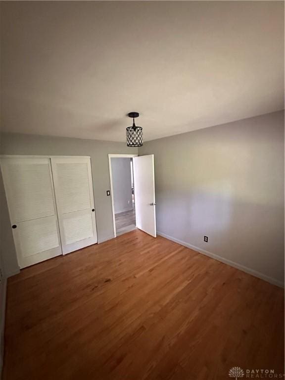 1314 Ridgeview Ave, Dayton, OH 45409 - unfurnished bedroom featuring wood finished floors and a closet