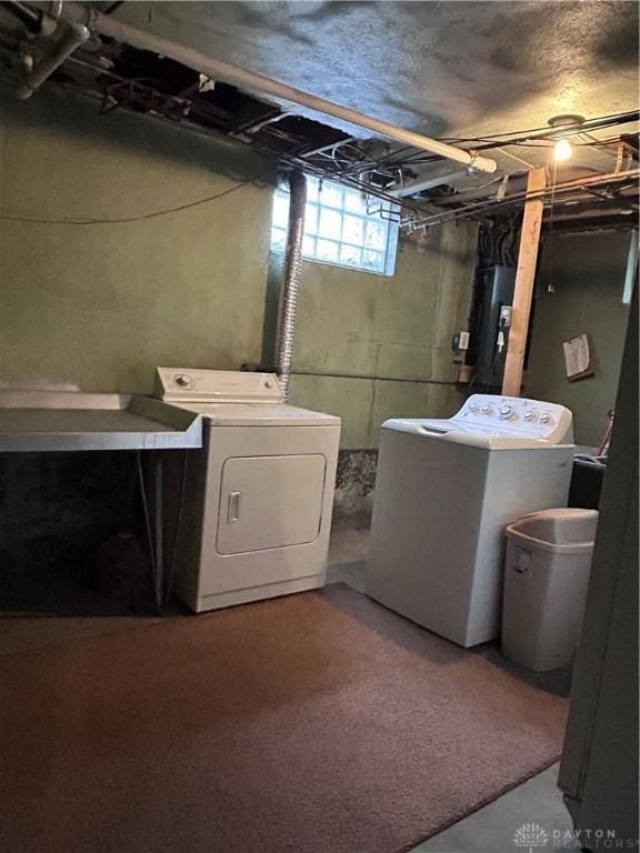 laundry area featuring washer and clothes dryer and laundry area