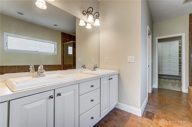1713 Country Corner Ln, Washington Twp, OH 45458 - full bathroom with double vanity, baseboards, and tiled shower