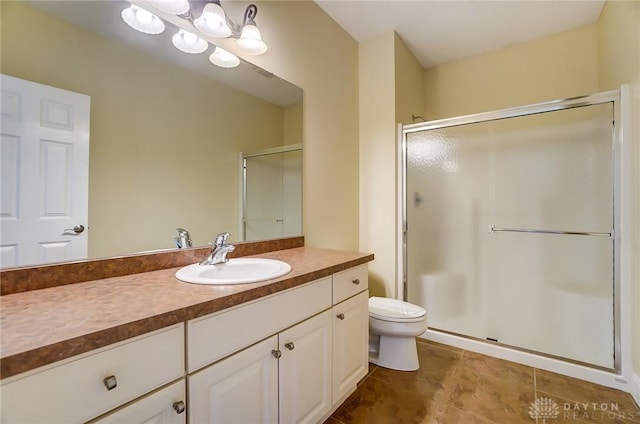 1713 Country Corner Ln, Washington Twp, OH 45458 - bathroom with a shower stall, vanity, toilet, and tile patterned floors