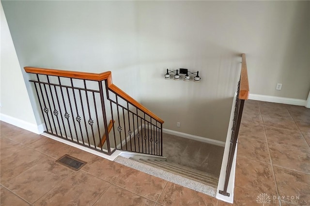 1713 Country Corner Ln, Washington Twp, OH 45458 - stairs with tile patterned flooring and baseboards