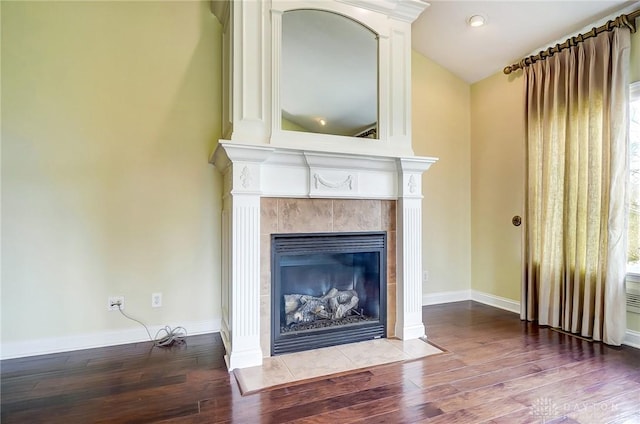 1713 Country Corner Ln, Washington Twp, OH 45458 - detailed view of wood finished floors, a tile fireplace, and baseboards