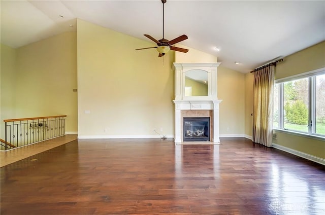 1713 Country Corner Ln, Washington Twp, OH 45458 - unfurnished living room featuring lofted ceiling, ceiling fan, a fireplace with flush hearth, wood finished floors, and baseboards