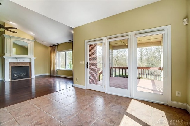 1713 Country Corner Ln, Washington Twp, OH 45458 - entryway featuring a ceiling fan, tile patterned floors, lofted ceiling, a fireplace, and baseboards