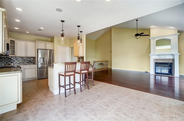 1713 Country Corner Ln, Washington Twp, OH 45458 - kitchen with stainless steel fridge, a ceiling fan, recessed lighting, open floor plan, and light tile patterned floors