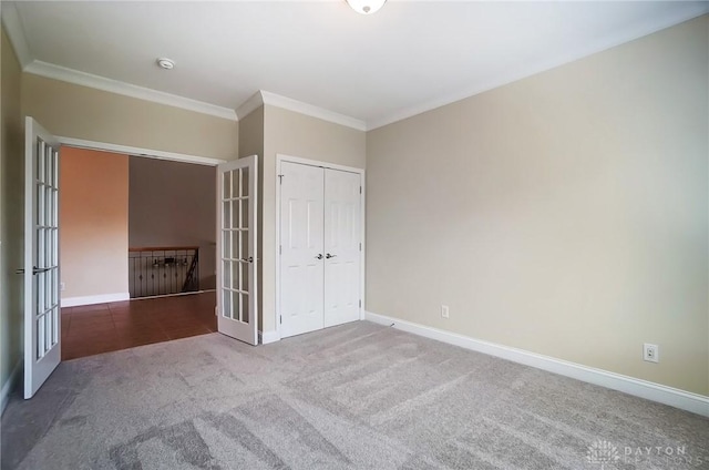 1713 Country Corner Ln, Washington Twp, OH 45458 - unfurnished bedroom featuring carpet floors, crown molding, french doors, and baseboards