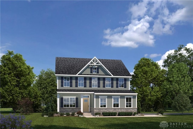 colonial home with a front yard, stone siding, and roof with shingles