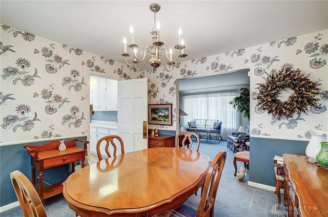 127 W Woodbury Dr, Dayton, OH 45415 - carpeted dining room featuring an inviting chandelier, wallpapered walls, and baseboards