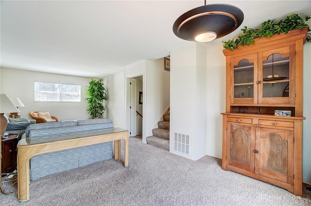 127 W Woodbury Dr, Dayton, OH 45415 - living room with stairway, visible vents, and light colored carpet