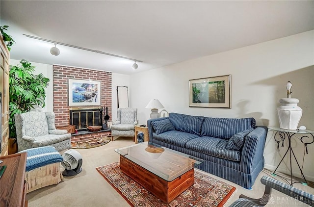 127 W Woodbury Dr, Dayton, OH 45415 - carpeted living area featuring a brick fireplace and rail lighting