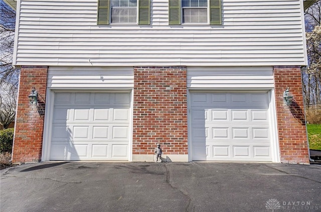 127 W Woodbury Dr, Dayton, OH 45415 - garage featuring driveway