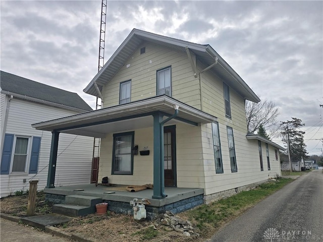 207 E Main St, New Paris, OH 45347 - view of front facade featuring a porch