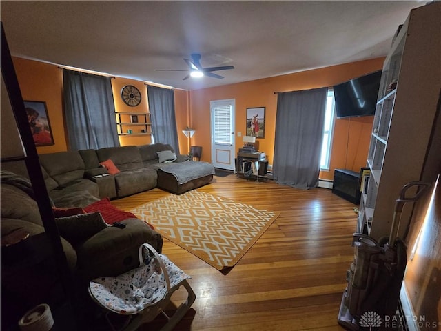 207 E Main St, New Paris, OH 45347 - living area featuring hardwood / wood-style floors and a ceiling fan