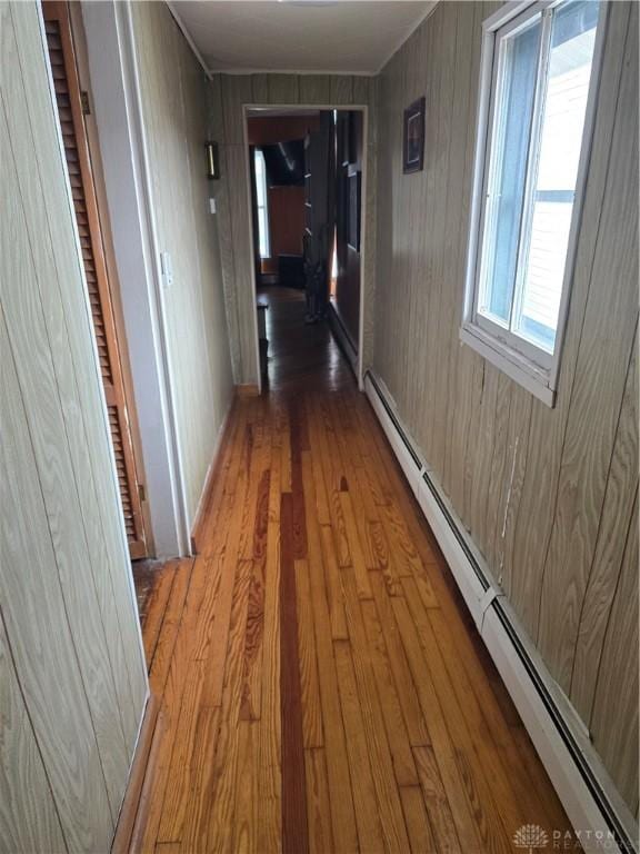 207 E Main St, New Paris, OH 45347 - hall featuring a baseboard radiator and wood finished floors