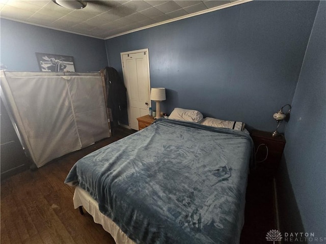 207 E Main St, New Paris, OH 45347 - bedroom with wood finished floors and crown molding