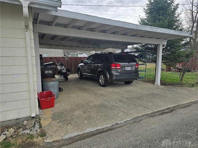 207 E Main St, New Paris, OH 45347 - view of vehicle parking with a carport