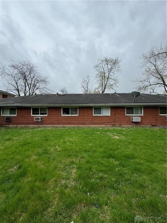 325 Ryburn Ave Unit 319-325, Dayton, OH 45405 - rear view of house with a yard and brick siding