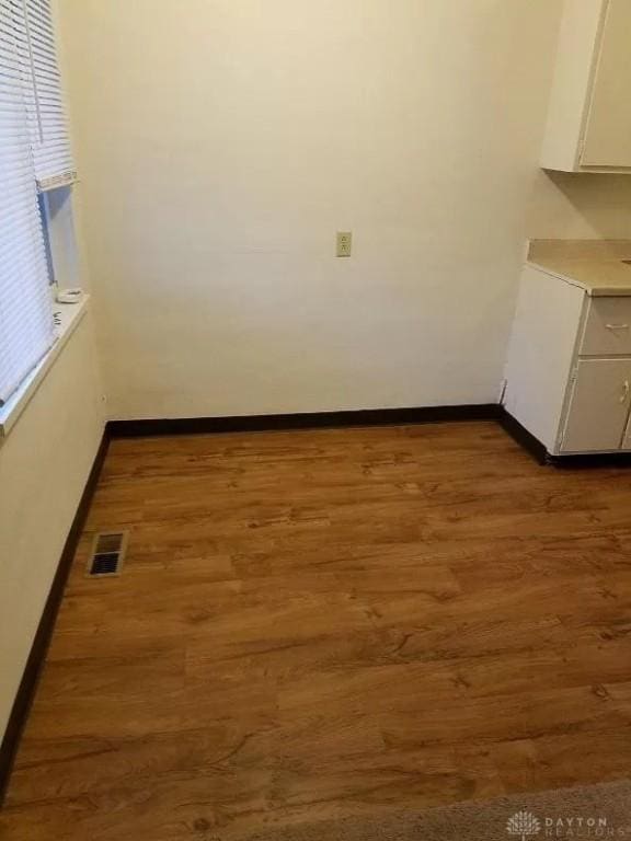 325 Ryburn Ave Unit 319-325, Dayton, OH 45405 - unfurnished dining area with baseboards and wood finished floors