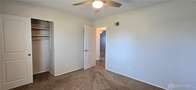 unfurnished bedroom featuring baseboards, carpet floors, visible vents, a ceiling fan, and a closet