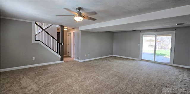 interior space with a ceiling fan, carpet, baseboards, and stairs