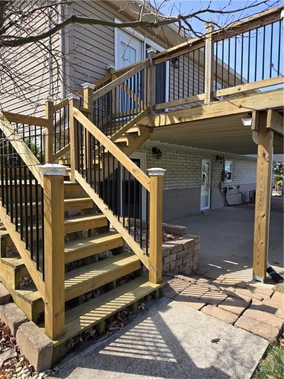 exterior space featuring a wooden deck and stairway
