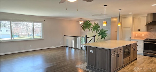 kitchen featuring gray cabinetry, black microwave, a ceiling fan, and stainless steel electric range